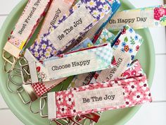 several keychains that say choose happy and be the joy