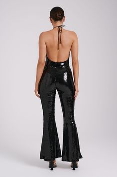 Zero disco ball required.The WILMA are a pair of sparkling wide-legged pants with a high waistline and flared hems. An invisible zipper closure at the side seam gives it a sleek, seamless silhouette. The legs transition into a flattering bootcut that complements its high, fitted waist. Lined sequinned fabrication adds a touch of comfortable glam, making these pants the perfect choice for all-night wear. Elegant Stretch Wide Leg Pants For Party, High-waisted Wide Leg Pants For Party, High-waisted Wide Leg Pants For Party Season, Sequin High-waisted Wide Leg Pants For Night Out, Sleek Metallic Bottoms For Night Out, Sleek Shiny Bottoms For Night Out, Fall Party High Waist Wide Leg Pants, Trendy Shiny Bottoms For Party, Sleek Shiny Bottoms For Party