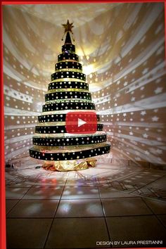 a large christmas tree with lights on it