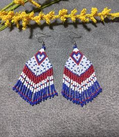 This pair of Patriotic Heart fringed beaded earrings are made high quality red, white and blue Delica beads with a silver ear wire. 100% handmade with passion and attention to detail. Each piece can take hours to complete. Great for any occasion! Fun to wear for the your 4th of July celebration! Go in style for Independence Day or any day!  Please check out the many other listings in my shop! https://barbsbeadingstudio.etsy.com Handmade in the heart of Oklahoma, USA I've made every effort to get Patriotic White Jewelry With Colorful Beads, Bohemian White Earrings With Heart Beads, White Bohemian Earrings With Heart Beads, Bohemian White Heart Beads Earrings, Blue Patriotic Beaded Earrings As Gift, Patriotic Blue Beaded Earrings As Gift, Patriotic Multicolor Dangle Jewelry, Patriotic Blue Beaded Earrings, Handmade Blue Patriotic Earrings