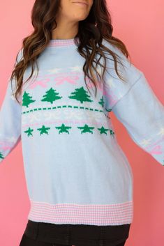 Get in the festive spirit with our Baby Blue Christmas Trees Bow Sweater. Featuring charming bows, trees, and stars detailing, this sweater is perfect for spreading holiday cheer. With striped cuffs and hem, this comfortable sweater is the perfect addition to your winter wardrobe. In a playful baby blue color, you'll be the most stylish at any Christmas party! Christmas trees & bows long sleeve Baby blue sweater Runs true to size Perfect for Christmas time! Great for watching movies and holiday Playful Winter Tops With Ribbed Cuffs, Cute Winter Tops With Ribbed Cuffs, Playful Winter Soft Knit Sweater, Cute Blue Winter Sweater, Playful Long Sleeve Christmas Sweater, Blue Christmas Holiday Sweater, Blue Christmas Trees, Baby Blue Sweater, Christmas Tree Bows