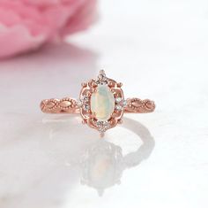 Natural Vintage Inspired Opal Ring ►Base Metal: Sterling Silver (925) ►Plating: 14K Rose Gold ►Accented With Simulated Diamonds (CZ) Gem size: 6.0 x 4.0 mm Carat Weight: 0.43 ct. Stone Creation: Natural Stone Origin: Brazil ► Solid rose gold ring can be purchased at: https://www.etsy.com/listing/694593215/vintage-natural-opal-ring-14k-solid-gold?ref=shop_home_active_1&frs=1 ►Sterling silver ring can be purchased at: https://www.etsy.com/listing/675970602/vintage-natural-opal-ring-sterling?re Classic Rose Gold Opal Ring For Anniversary, Heirloom Style Rose Gold Opal Ring For Anniversary, Vintage Rose Gold Rings With Birthstone, Heirloom Rose Gold Opal Ring Gift, Vintage Rose Gold Birthstone Ring, Rose Gold Opal Ring With Halo Setting For Anniversary, October Birthstone Jewelry, Natural Opal Ring, Rose Gold Accents