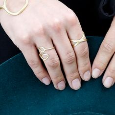 This adjustable brass mix ring features two graceful leaf shapes that meet in the center, electroplated in beautiful metallic tones. Crafted by hand in India through fair trade partnerships, it is a stunning addition to any ensemble. Brass Open Midi Rings, Brass Stackable Open Rings, Leaf Ring, Leaf Shapes, Adjustable Ring, Adjustable Rings, Fair Trade, Heart Ring, Gold Rings