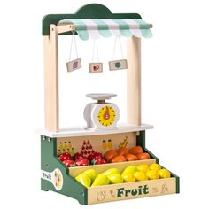 a wooden fruit stand with fruits and vegetables