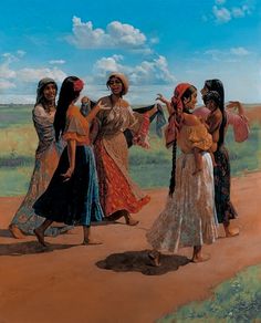 four women walking down a dirt road in front of a green field and blue sky