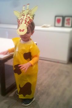 a little boy dressed up as a giraffe