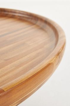 a close up of a wooden tray on a white surface with no people around it