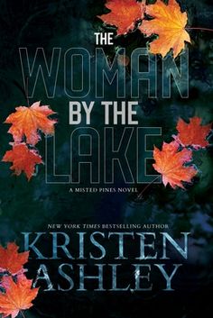 the book cover for the woman by the lake, with autumn leaves floating on it