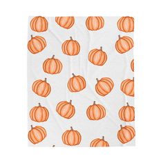 an orange and white pumpkin pattern on a blanket that has been drawn with pencils