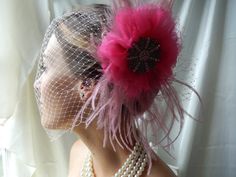 Feathered Fascinator - Hot Pink Fascinator - Jeweled Fascinator - Bridal Head Piece - Pink Veil & Headpiece  This beautiful fascinator features pink goose and ostrich feathers tucked behind a tulle and chiffon handmade flower.  Atop the flower is this stunning silver and pink brooch!  The birdcage veil sweeps across the face and attaches with a tiny silver comb.  The veil can also be tucked behind the fascinator!  I would love to accommodate your ideas...just convo me! Bridal Head Piece, Pink Veil, The Birdcage, Pink Brooch, Veil Headpiece, Pink Fascinator, Wedding Hair Piece, Feather Wedding, Birdcage Veil