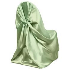 the back of a chair covered in a green satin material with a bow on it