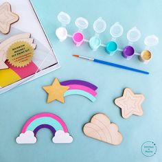 wooden cutouts and crafting supplies on a blue background