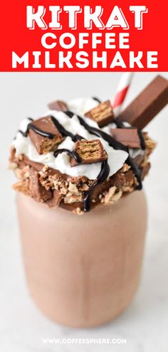 a chocolate milkshake topped with whipped cream and candy bars