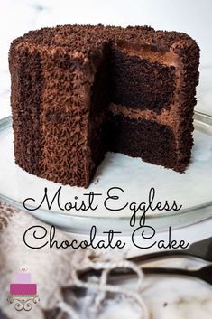 a chocolate cake on a plate with the words moist eggless chocolate cake