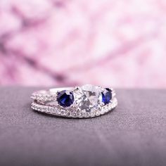 two diamond and blue sapphire engagement rings