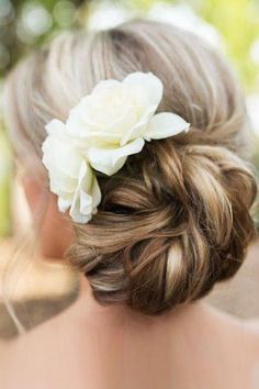 a woman wearing a flower in her hair