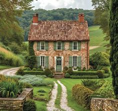 a painting of a stone house in the country side with green bushes and trees surrounding it