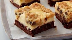 some brownies with white frosting and chocolate chips