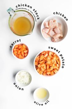 ingredients for chicken soup laid out on a white surface