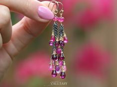 "THE JEWELRY IS SHIPPED via DHL EXPRESS (2-5 days delivery door to door). THE DHL SHIPPING COST IS INCLUDED IN THE PRICE. The Pink Lady Earrings - Solid Gold 14K Pink Sapphire, Pink Tourmaline and Rhodolite Garnet Tassel Earrings, Mixed Metal Earrings ► Measurements / Details: - Length including french earwires: 2.5\" (~6.4 cm) - Metals: Solid Gold 14K + Oxidized Silver Chains ► Gemstones: The earrings include excellent AAA quality gemstones, superbly faceted and vibrant: ~ Pink Sapphires in dif Elegant Dangle Tourmaline Jewelry, Elegant Tourmaline Dangle Earrings, Yellow Gold Tourmaline Dangle Jewelry, Pink Gemstone Accented Party Earrings, Pink Drop Earrings With Gemstone Accents, Yellow Gold Tourmaline Dangle Earrings, Pink Bohemian Gemstone Earrings, Pink Natural Stone Drop Earrings, Bohemian Pink Gemstone Earrings