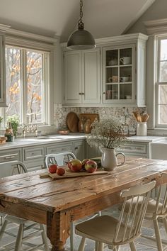 a wooden table sitting in the middle of a kitchen