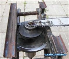 an old metal machine sitting on top of a sidewalk