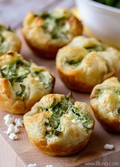 spinach and cheese puffs on a cutting board