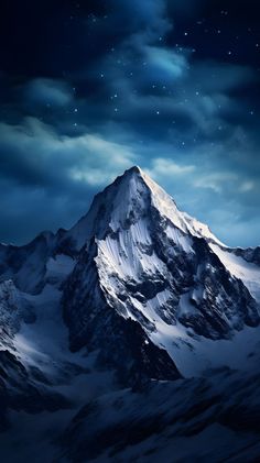 a snow covered mountain under a night sky with stars and clouds in the background,