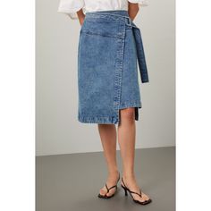 Blue denim (100% Cotton). A-line. Tie closure. 28.5" from waist to hemline. Imported. Spring Medium Wash Denim Skirt With Belt Loops, Spring Denim Skirt With Belt Loops In Medium Wash, Relaxed Denim Skirt For Work, Spring Medium Wash Skirt With Belt Loops, Spring Workwear Denim Skirt, Straight Leg, Denim Straight Leg Skirt For Work, Workwear Straight Leg Denim Skirt, Relaxed Mid-rise Denim Skirt, Short Length Denim Jeans For Workwear