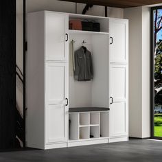 a large white closet with open doors and shelves