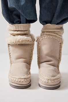 Cozy Round Toe Boots For Cold Weather, Cozy Cold Weather Boots With Round Toe, Beige Shearling Boots For Fall, Fluffy Winter Boots, Cream Shearling Boots For Winter, Beige Sheepskin Boots For Winter, Winter Cream Leather Mid-calf Boots, Luxury Sheepskin Women's Boots, Cream Shearling Winter Boots