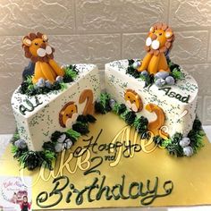 a birthday cake with two lions on it