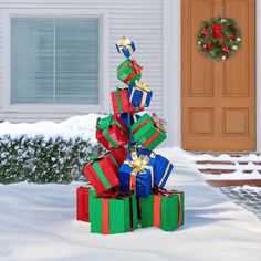 presents are stacked on top of each other in the snow