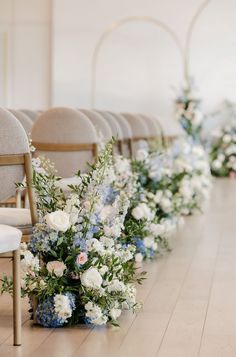 rows of chairs lined up with flowers on them