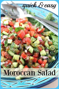 a blue plate topped with cucumber and tomato salad