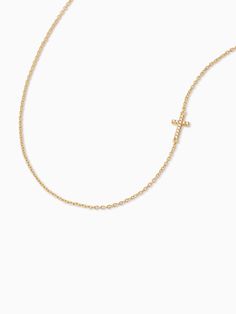 This small, studded cross pendant affixed to a simple gold chain is the finishing touch to any look. Crafted with 18k gold over sterling silver and real, slightly included round-cut diamonds, this is a dainty necklace you’ll want in your collection forever. Pair our Side Cross Vermeil Necklace with our Cross Vermeil Huggies for a full Vermeil look. | Gold Vermeil Side Cross Chain Necklace | Women's Jewelry by Uncommon James 14k Gold Delicate Chain Cross Necklace, 14k Yellow Gold Cross Necklace With Adjustable Chain, Gold-tone Cross Necklace Gold Plated, Simple Gold Chain, Elegant 14k Gold-filled Cross Pendant Necklace, Uncommon James, Yellow Gold Crucifix Cross Necklace, Gold Plated, Cross Chain, Vermeil Jewelry