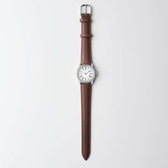 A classic, nut-brown watch strap is crafted in smooth, oh-so-buttery leather that wears beautifully over time. Our go-to on the weekends when black feels a little too formal for casual wear. Brown Watch Strap, Brown Watch, White Dial Watch, Brown Watches, Luxury Watch Brands, Pocket Watches, Brown Leather Strap, Leather Silver, Beautiful Watches