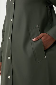 Inspired by the quality and feel of his grandfather's old raincoat, Alexander Stutterheim set out to re-produce a modern version of this classic. Designed in Stockholm, made in Europe- each raincoat is handmade from 100% rainproof rubberized cotton and produced by dedicated Stutterheim seamstress. Each one is numbered and signed by its creator, making each coat as unique as the other.With feminine style in an A-line silhouette, the Green Mosebacke Jacket is still your go-to, year-round raincoat. Fall Raincoat For Rainy Weather, Fall Raincoat With Button Closure For Rainy Weather, Classic Waterproof Raincoat For Fall, Classic Solid Waterproof Raincoat, Classic Waterproof Solid Color Raincoat, Classic Waterproof Solid Raincoat, Classic Outerwear For Rainy Weather, Classic Outerwear For Rainy Season, Classic Outdoor Raincoat