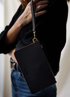 Leather wristlet in black from WP Standard. Elegant Leather Wristlet With Card Slots, Brown Leather Wristlet With Removable Pouch, Leather Rectangular Wristlet With Zipper Closure, Adjustable Leather Rectangular Wristlet, Black Rectangular Leather Wristlet, Black Wristlet, Phone Cards, Michael Kors Men