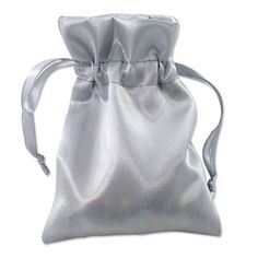 a silver satin bag on a white background