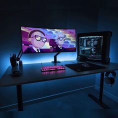 a computer desk with two monitors and a keyboard on top of it in the dark