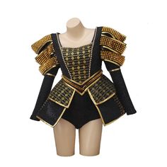 a mannequin wearing a black and gold costume