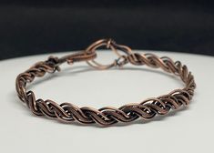 Braided Coiled and Bare Copper Bracelet. 7" long. This bracelet has been antiqued, polished and sealed. Sealed with Protectaclear. ProtectaClear is a clear, protective coating that is tough enough to protect jewelry and is safe for wear against skin. ProtectaClear is practically invisible once applied and will seal and protect jewelry from tarnish, oxidation, and corrosion. Adjustable Spiral Copper Bracelets, Adjustable Spiral Copper Bracelet, Adjustable Copper Spiral Bracelet, Sunstone Bracelet, Wire Wrap Jewelry Designs, Diy Braids, Copper Cuff Bracelet, Labradorite Bracelet, Copper Cuff