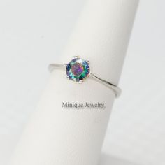 "We proudly offer the minimalist Alexandrite color 6 mm round gemstone ring in sterling silver. You have the option of making a set of trio, ring, necklace, and earrings. This dainty looking with a significant round color-changing gemstone ring is tarnish-resistant and rhodium plated. Perfect gift for Christmas, Valentine's Day, Mother's Day, Aniversary, and just for gifting. Alexandrite is June Birthstone. 🎀 Dimensions: Gemstone width: 6 mm (1/4 \") 🎀 Please note that pictures are magnified t Minimalist Sterling Silver Birthstone Ring, Iridescent Sterling Silver Round Jewelry, Iridescent Round Sterling Silver Jewelry, Minimalist Iridescent Jewelry For Gifts, Minimalist Iridescent Jewelry As Gift, Iridescent Minimalist Jewelry For Gift, Iridescent Minimalist Jewelry Gift, Adjustable Minimalist Solitaire Birthstone Ring, Minimalist Round Gemstone Birthstone Ring