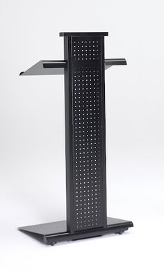 a black podium with perfored design on the top and bottom shelf for speakers