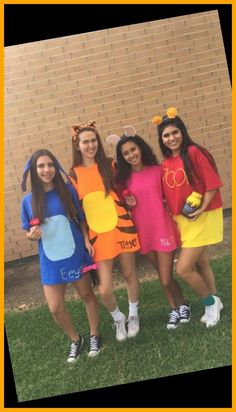 four girls dressed up as winnie the pooh and tigger