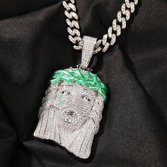 Kick your personal style up a notch with this iced-out Jesus piece pendant. This hip-hop rapper-style men's necklace bears a stunning Jesus piece design and is ideal for parties, performances, or as a gift for a special person. This iced-out necklace is made with copper, micro-paved AAA CZ stone, and has a gorgeous silver-gold color. Get hold of this necklace now!Specifications Style: Hiphop/Rock Shape\pattern: JESUS PIECE Product Style: Hip Hop Rapper Product Shape: JESUS PIECE Pendant Size: 85 White Bling Necklaces For Streetwear, White Pendant Necklace For Streetwear, Iced Out Pendant Necklace For Streetwear, Streetwear Iced Out Pendant Necklace, Iced Cuban Link Necklace For Gift, Cuban Link Rope Chain Necklace For Streetwear, Streetwear Cuban Link Rope Chain Necklace, Iced Out Pendant Jewelry For Streetwear, Iced Out Pendant For Streetwear