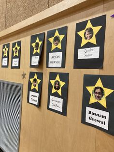 the bulletin board has been decorated with yellow stars and black paper on it's sides