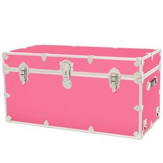 a large pink trunk sitting on top of a white floor