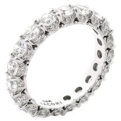 a white gold ring with rows of diamonds